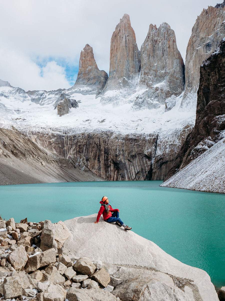 Woman sitting on rock at the viewpoint of Base de Torre