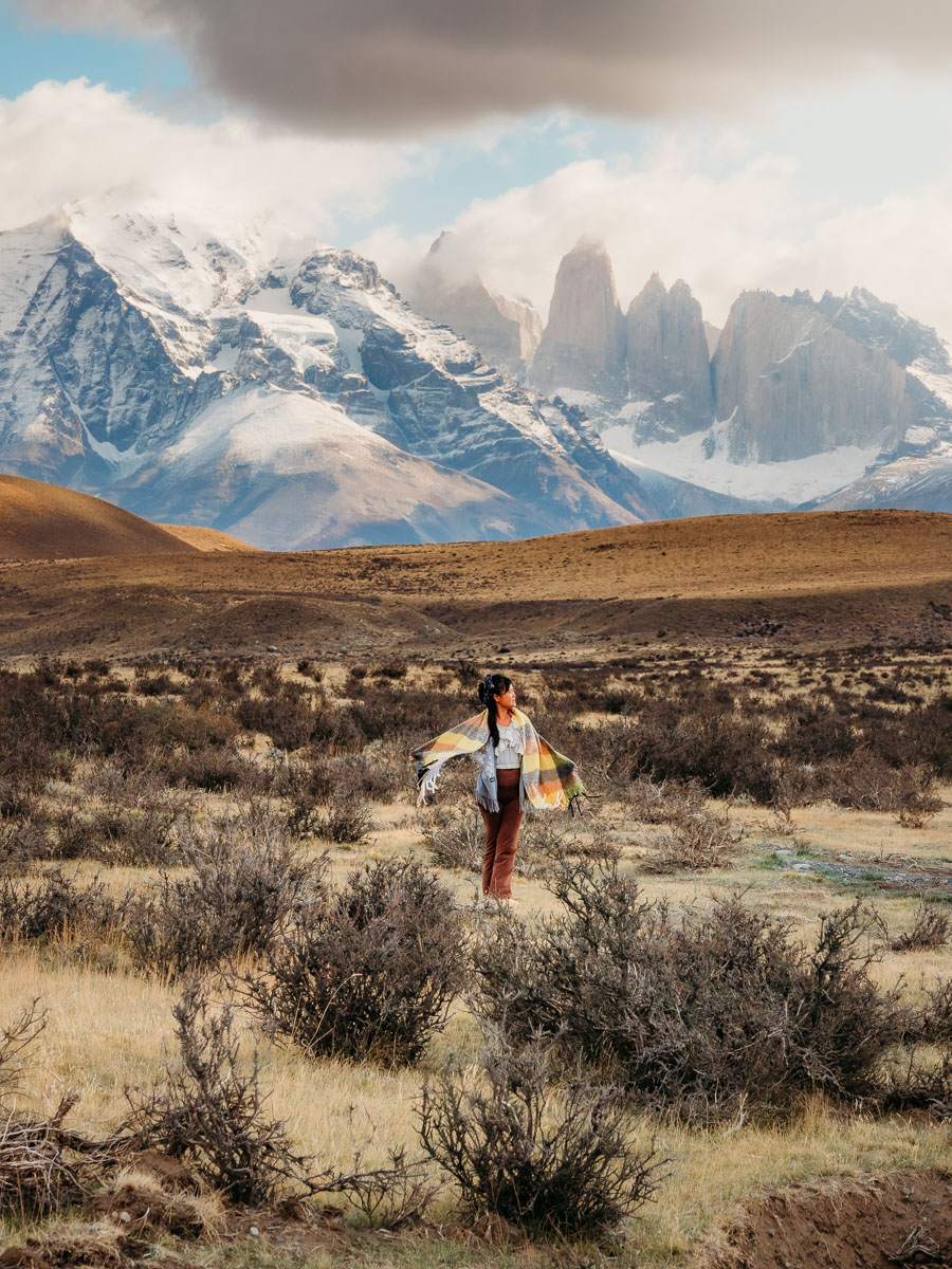 Standing in the grass field of Torres del Paine
