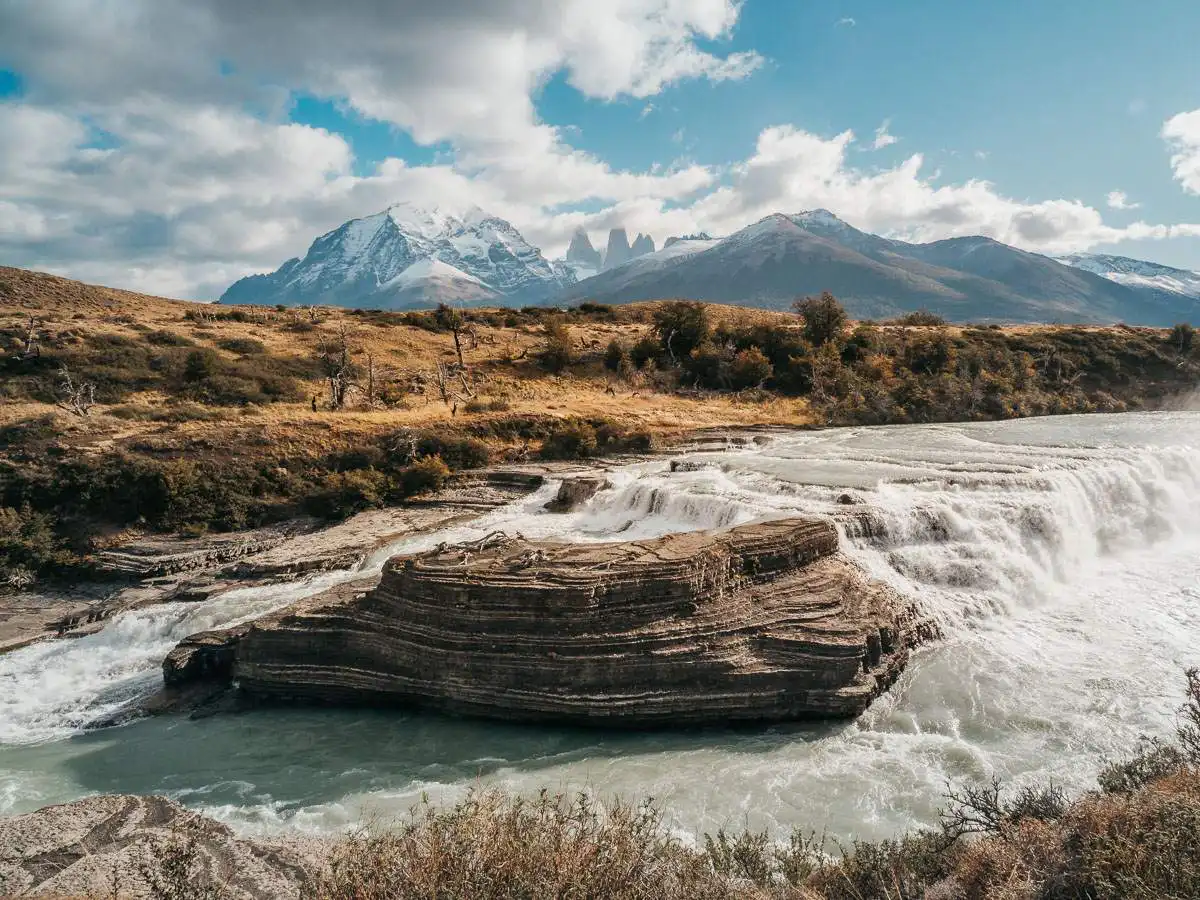 Waterfall in Chile Patagonia with mountains in the background
