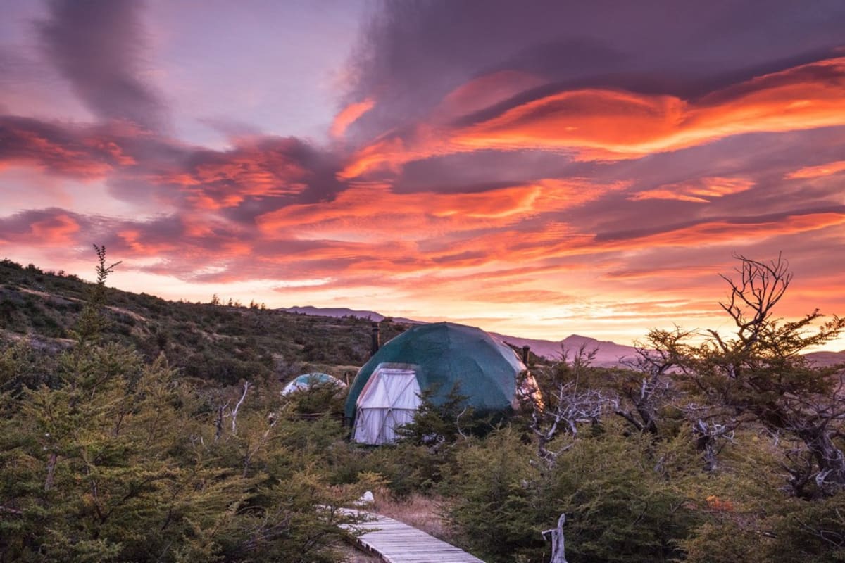 sunset in front of the geodesic domes of eco camp patagonia