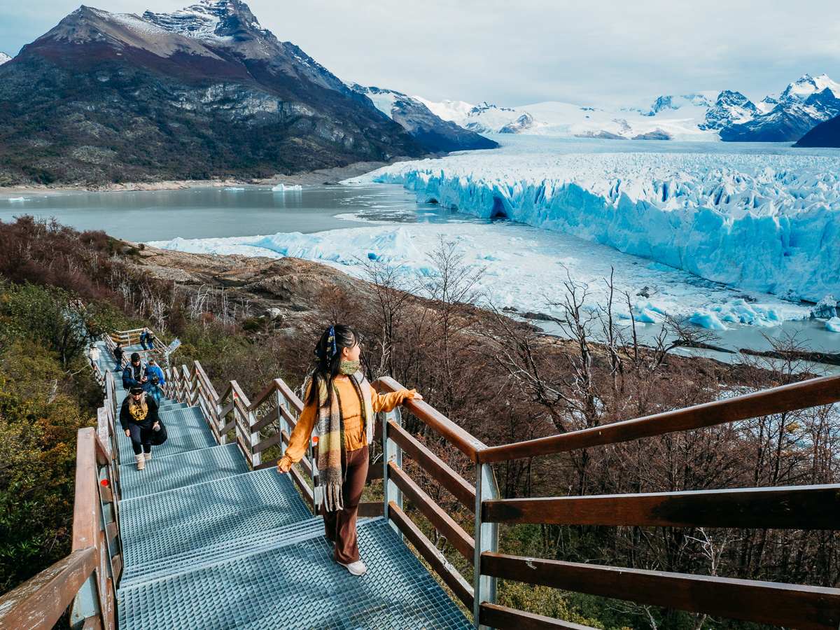 woman walking on the boardwalk in perito moreno glacier