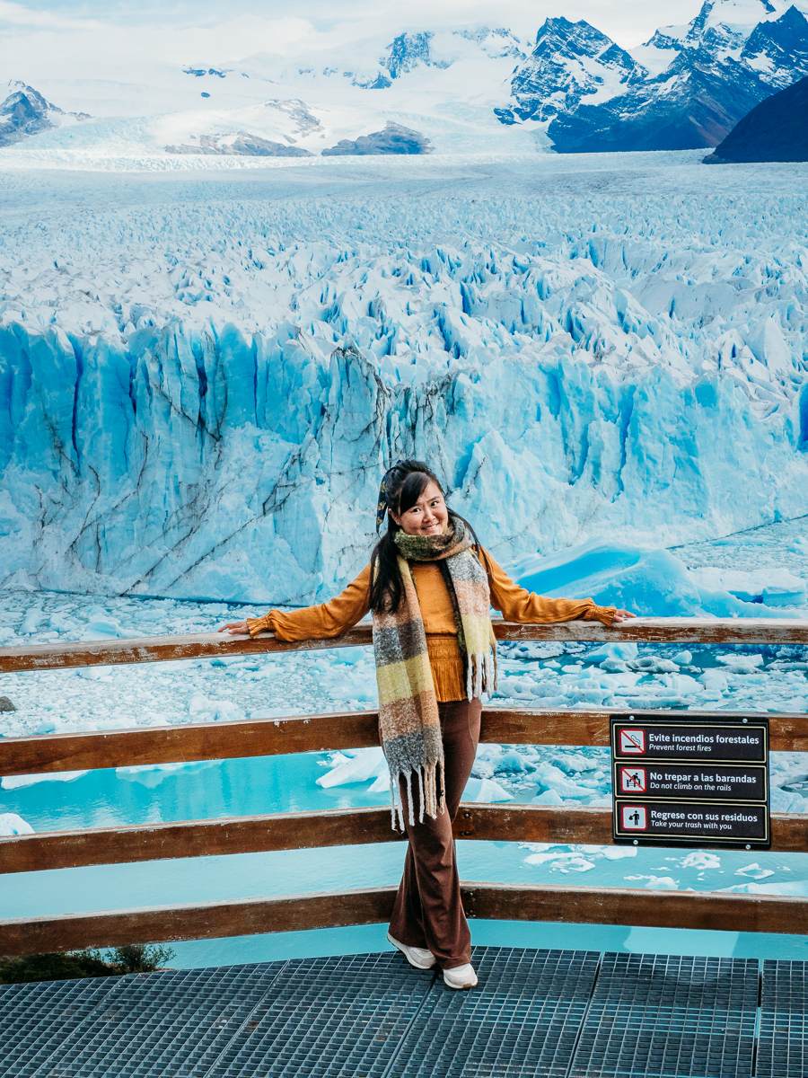 woman standing in front of perito moreno glacier