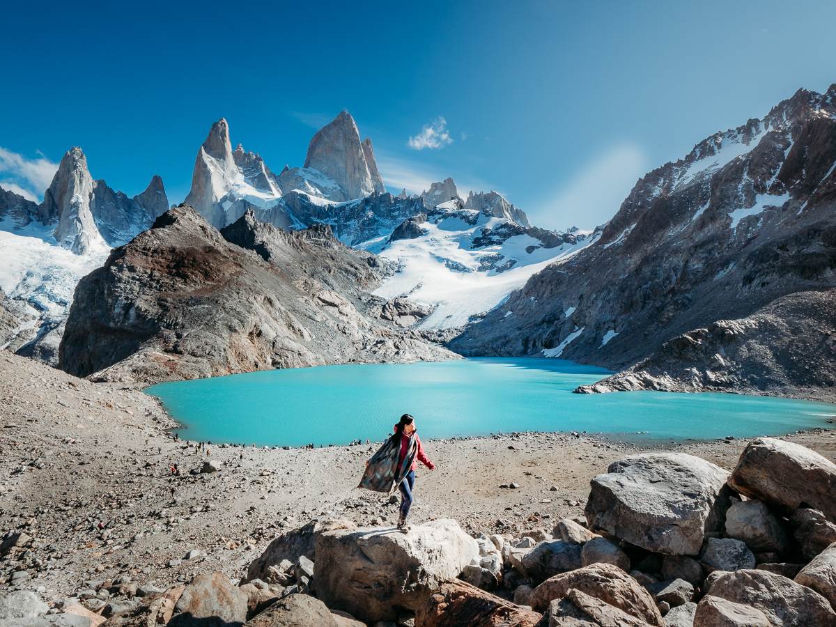 Woman standing at the summit of Laguna Los Tres hike