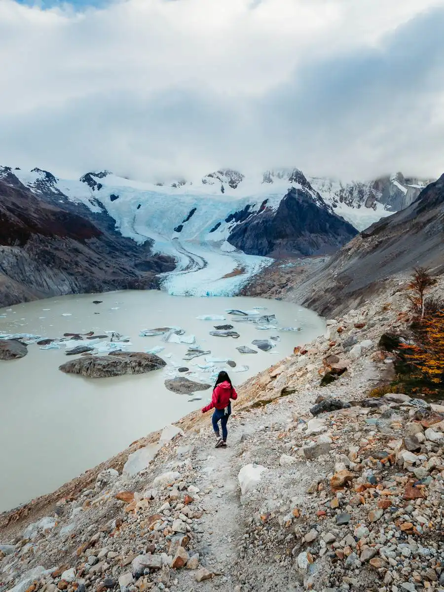 Standing on the hiking trail leading to the icebergs in Laguna Torre hike in Argentina Patagonia