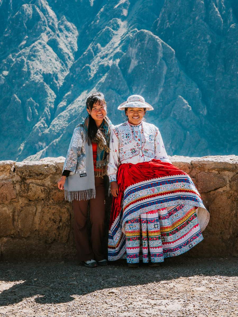 Woman dressed in traditional clothing at Colca Canyon condor viewpoint