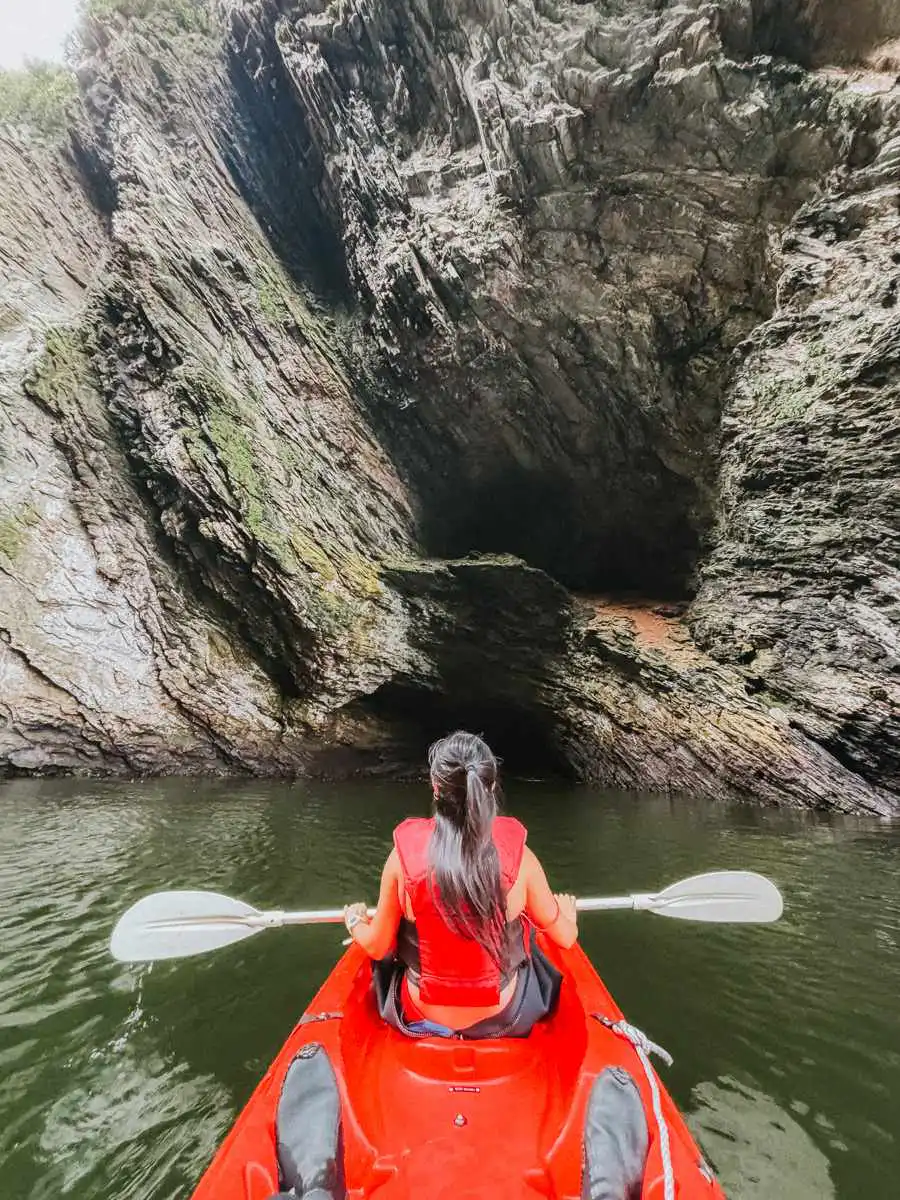 kayaking in front of cave in garden route