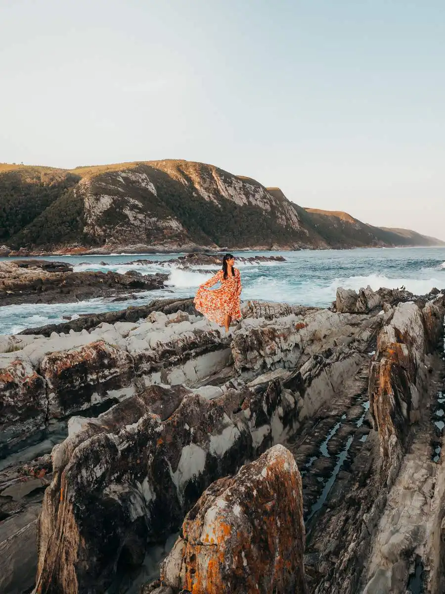 standing on the rocks at storms river mouth