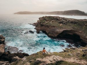 Woman sitting at the viewpoint on Robberg Nature Reserve