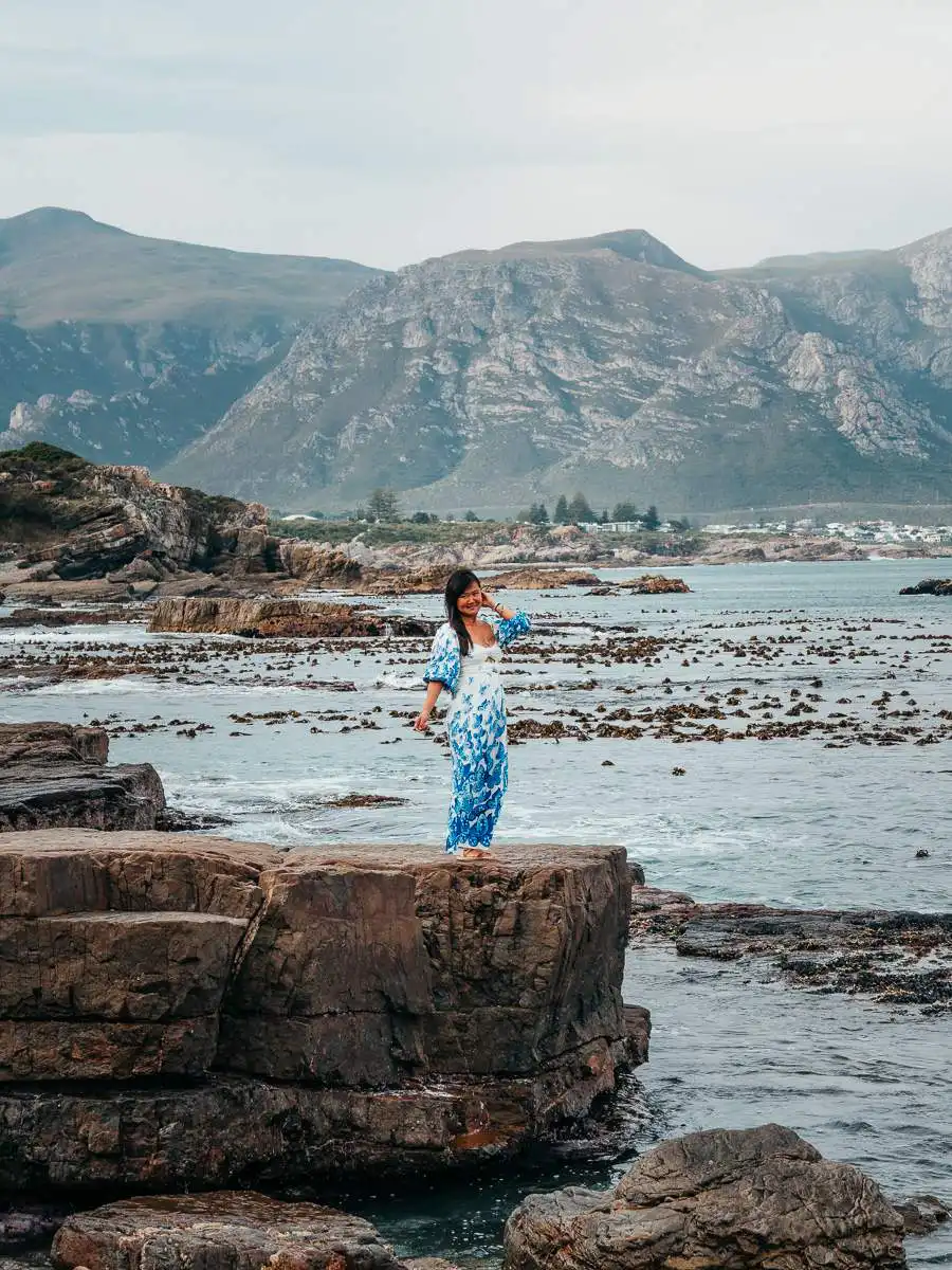 woman standing on the coast at hermanus