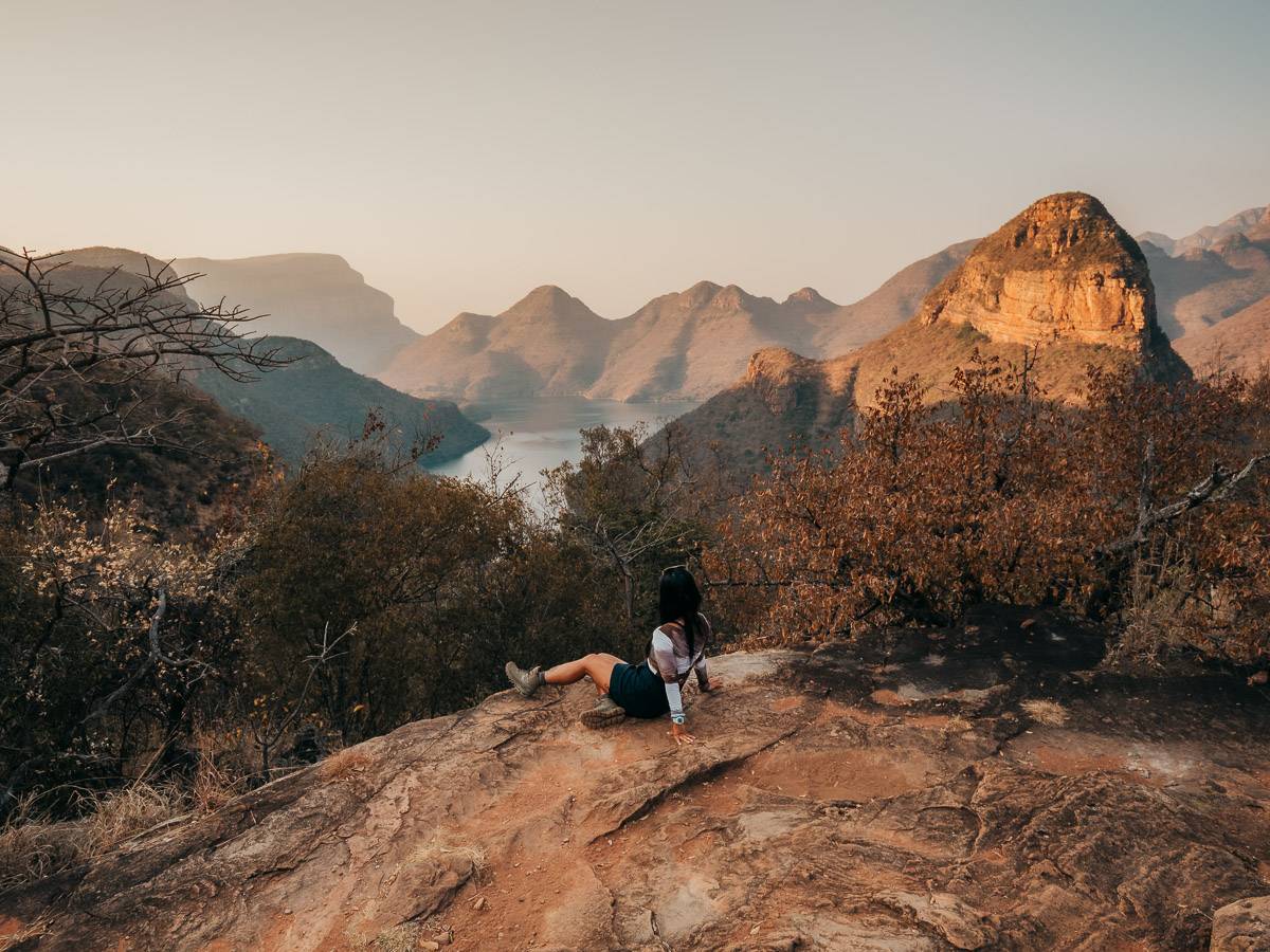 sitting at viewpoint of panorama route overlooking the lake