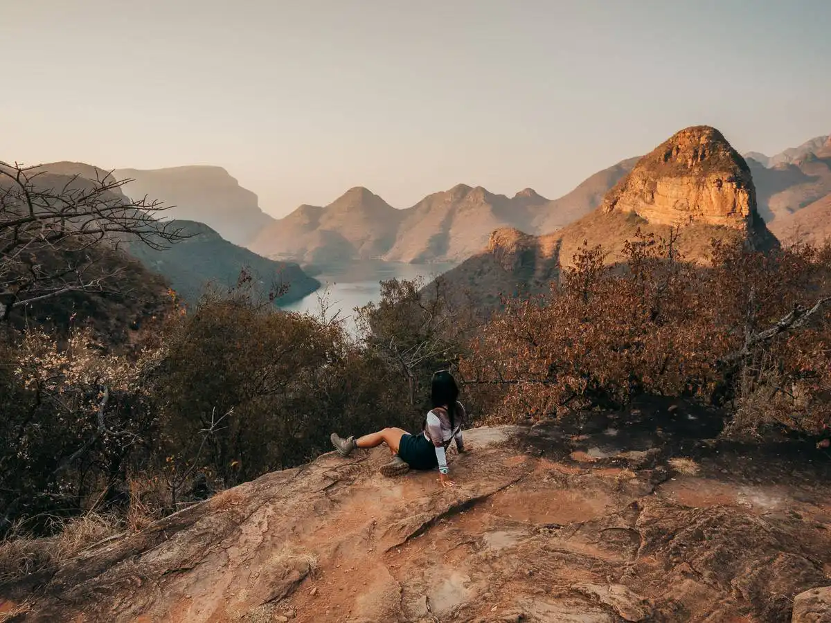 sitting at viewpoint of panorama route overlooking the lake