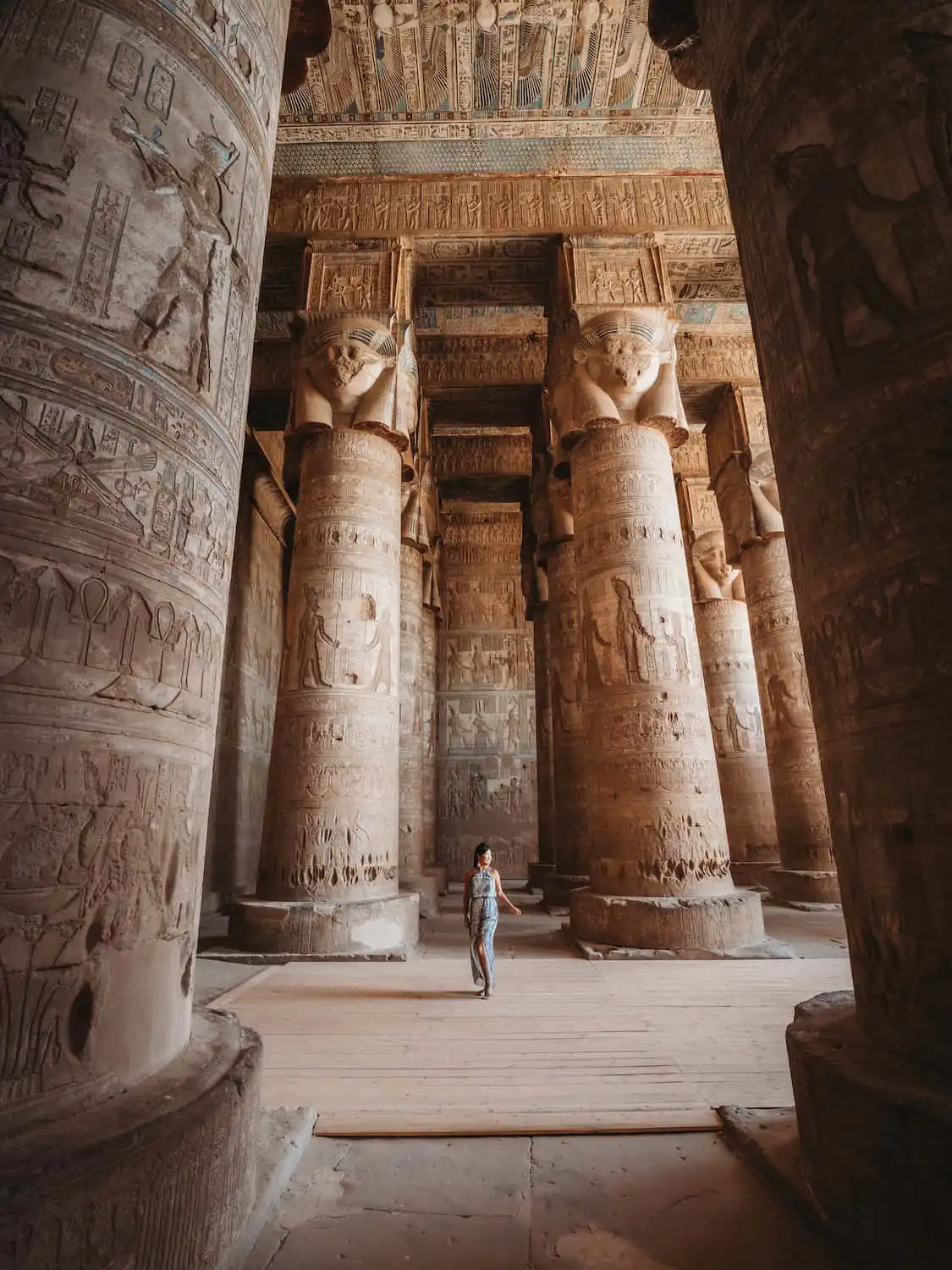 Woman standing amongst the pillars of Dendera Temple