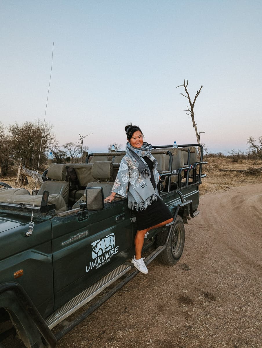 standing on the game vehicle in umkumbe safaro lodge south africa