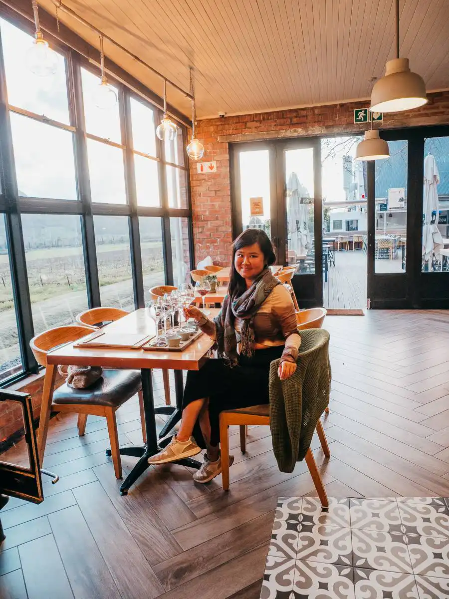 Woman sitting drinking wine in Cape Town