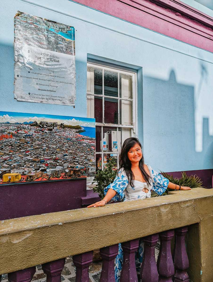 Woman standing in front of wall art in Bo-Kaap