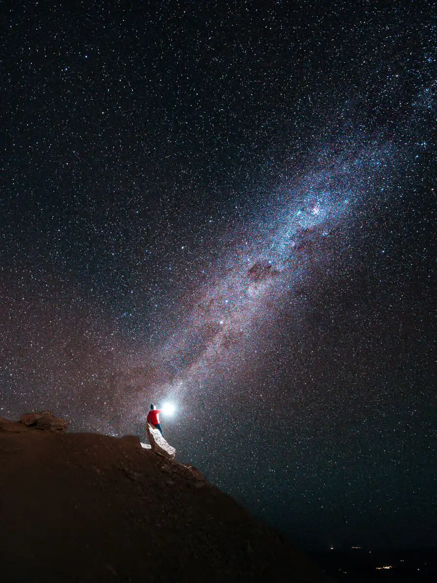 Sitting on rock stargazing in Atacama Desert