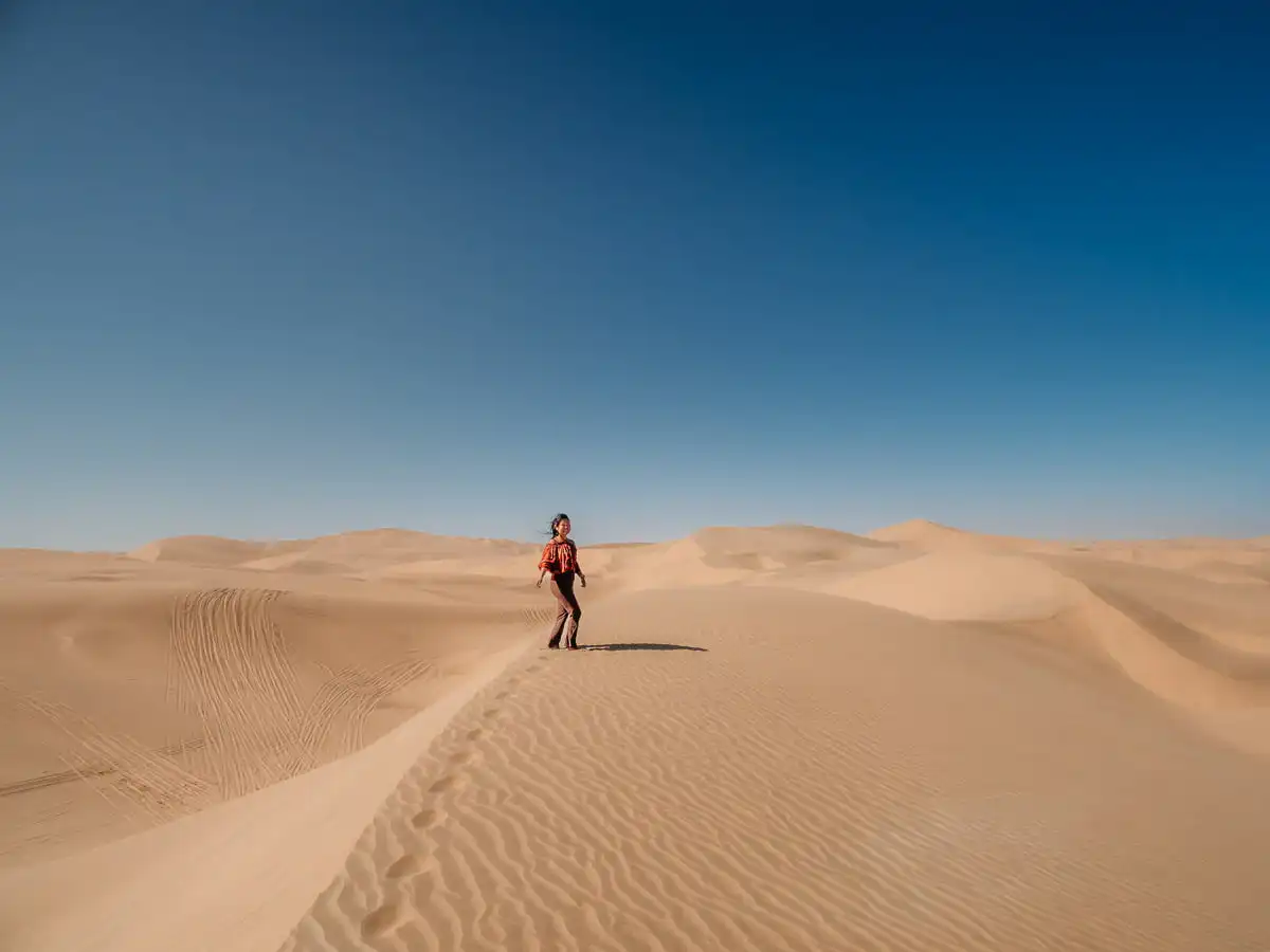 standing on the sand dunes of sandwich harbour tour