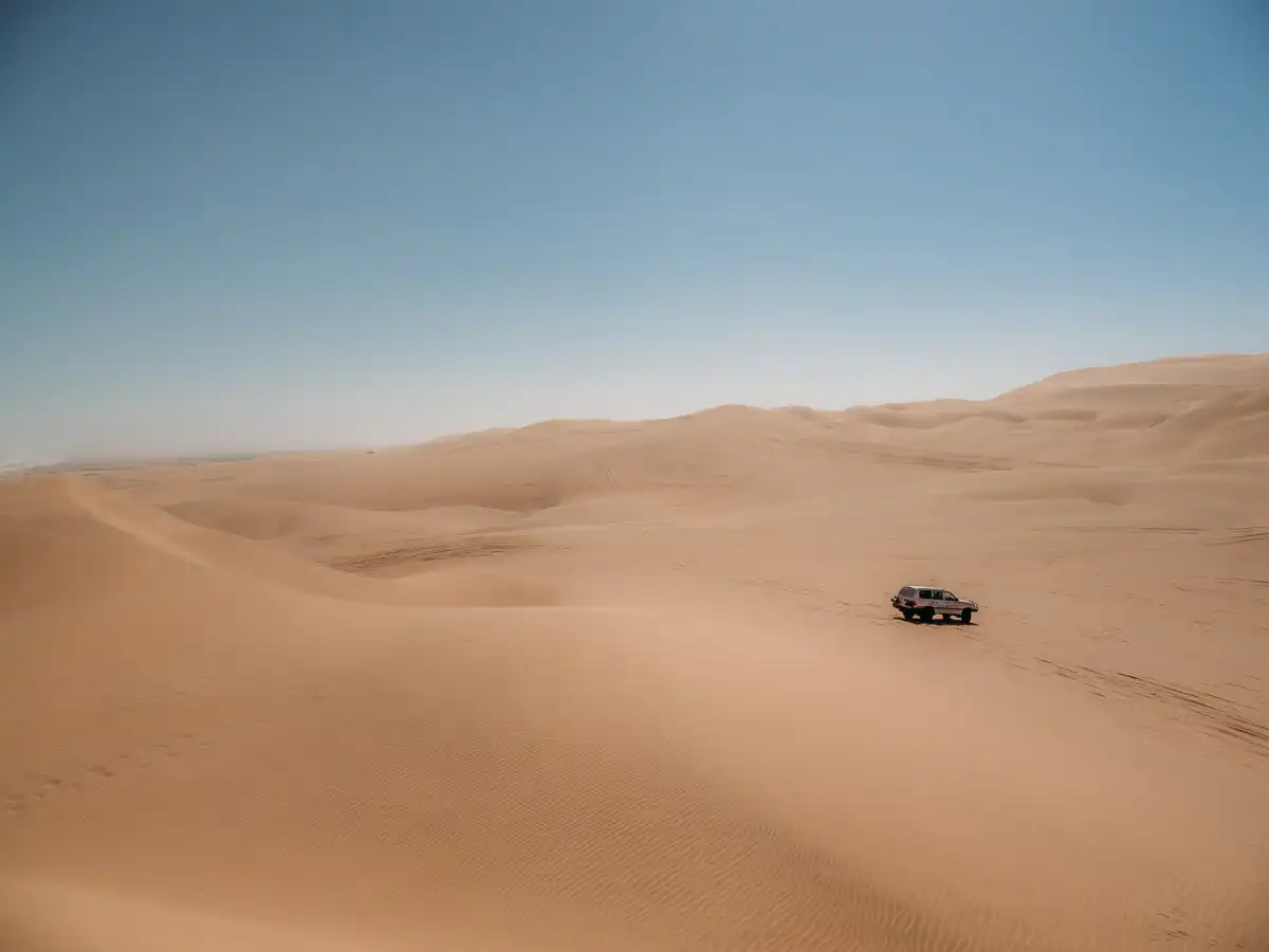 car in the vast sand dunes of Sandwich Harbour