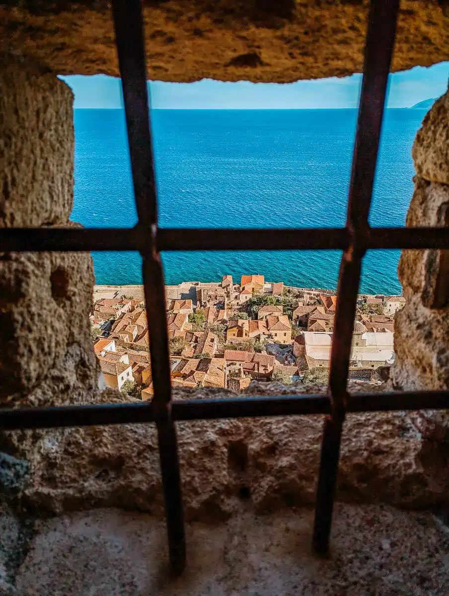 View of monemvasia through window gate