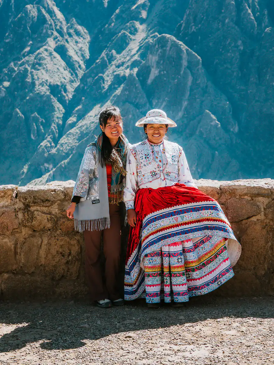 at colca canyon with one of the locals in a beautiful dress