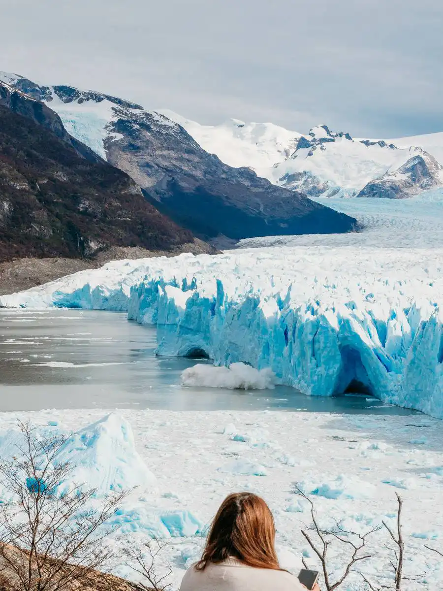 ice calving into the water from perito moreno glacier