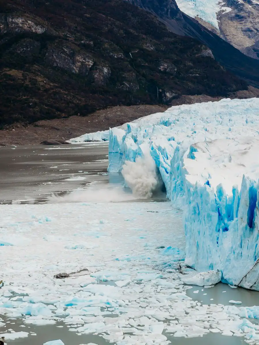 ice calving into the water