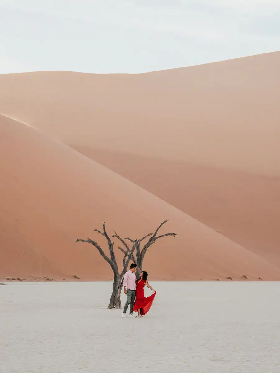 Me and nan standing at Deadvlei and sand dunes in Sossusvlei