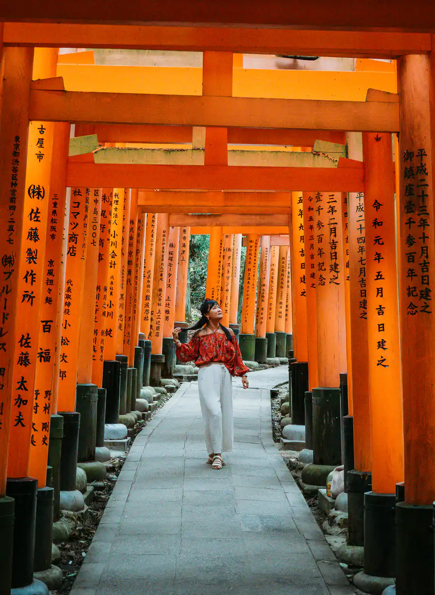 woman standing in fushimi inari