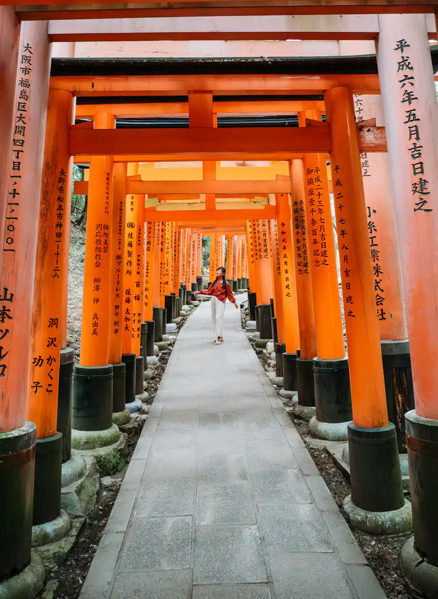 woman standing at fushimi inari