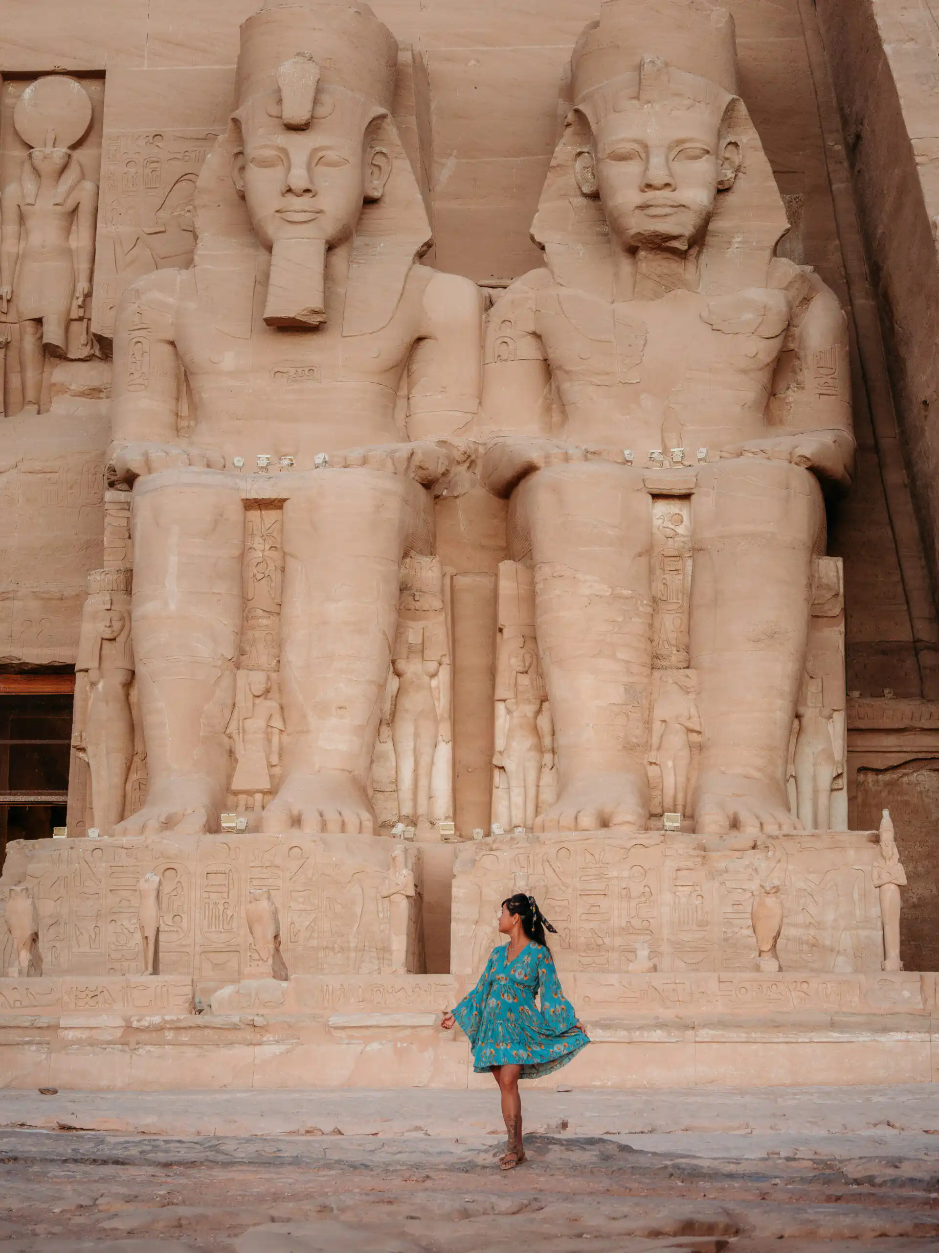 woman standing in front of abu simbel temple