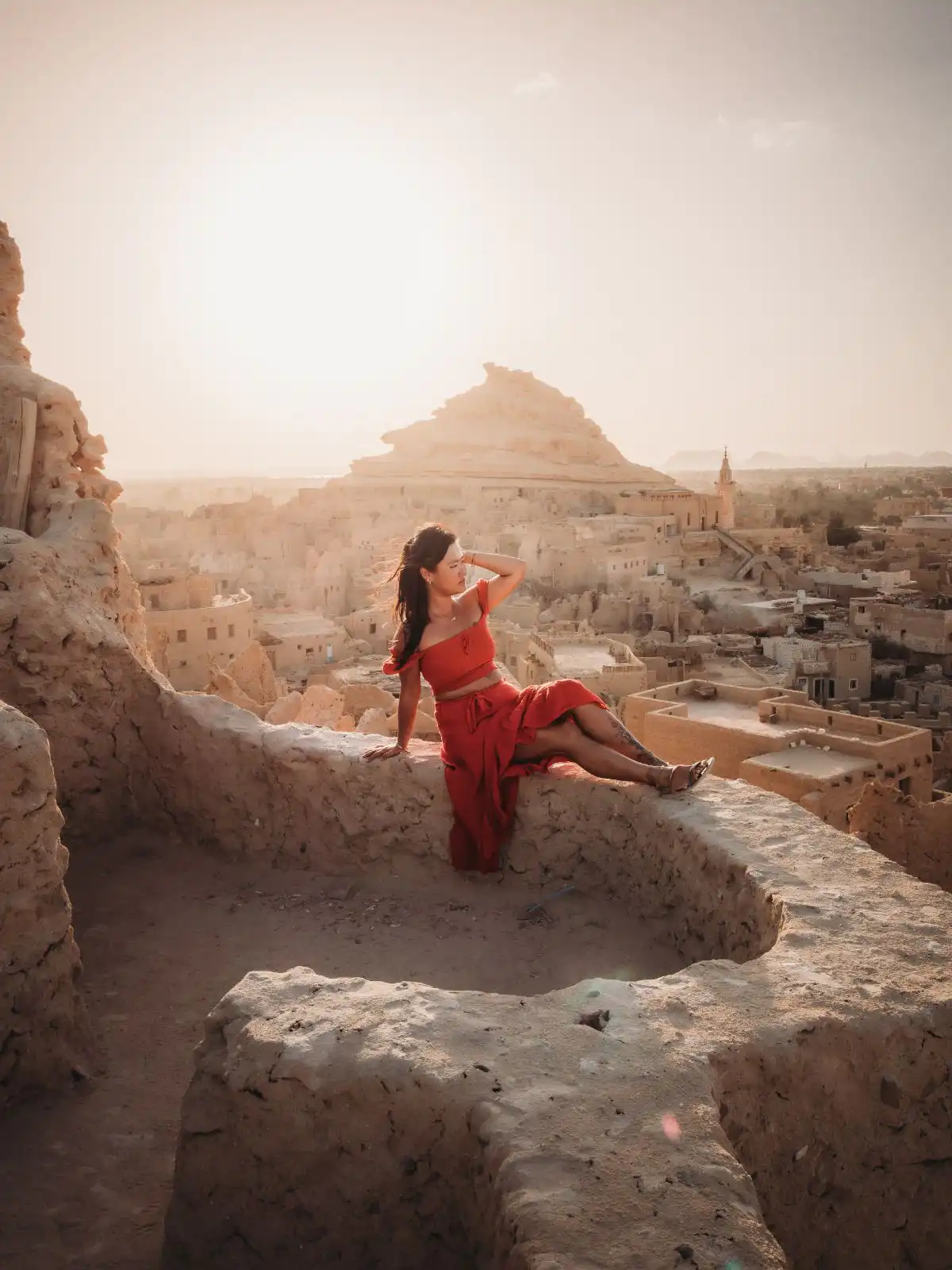 sitting at shali fortress during sunset