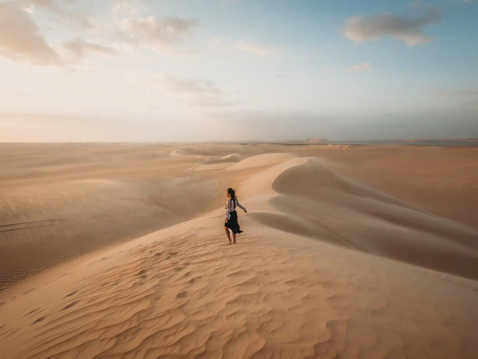 standing in the great sand sea in siwa
