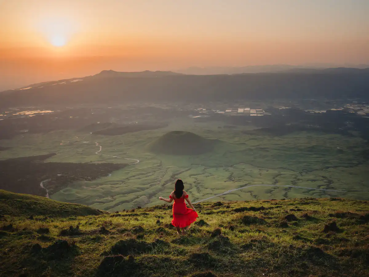 Standing at sunset on kishimadake hike in mount aso