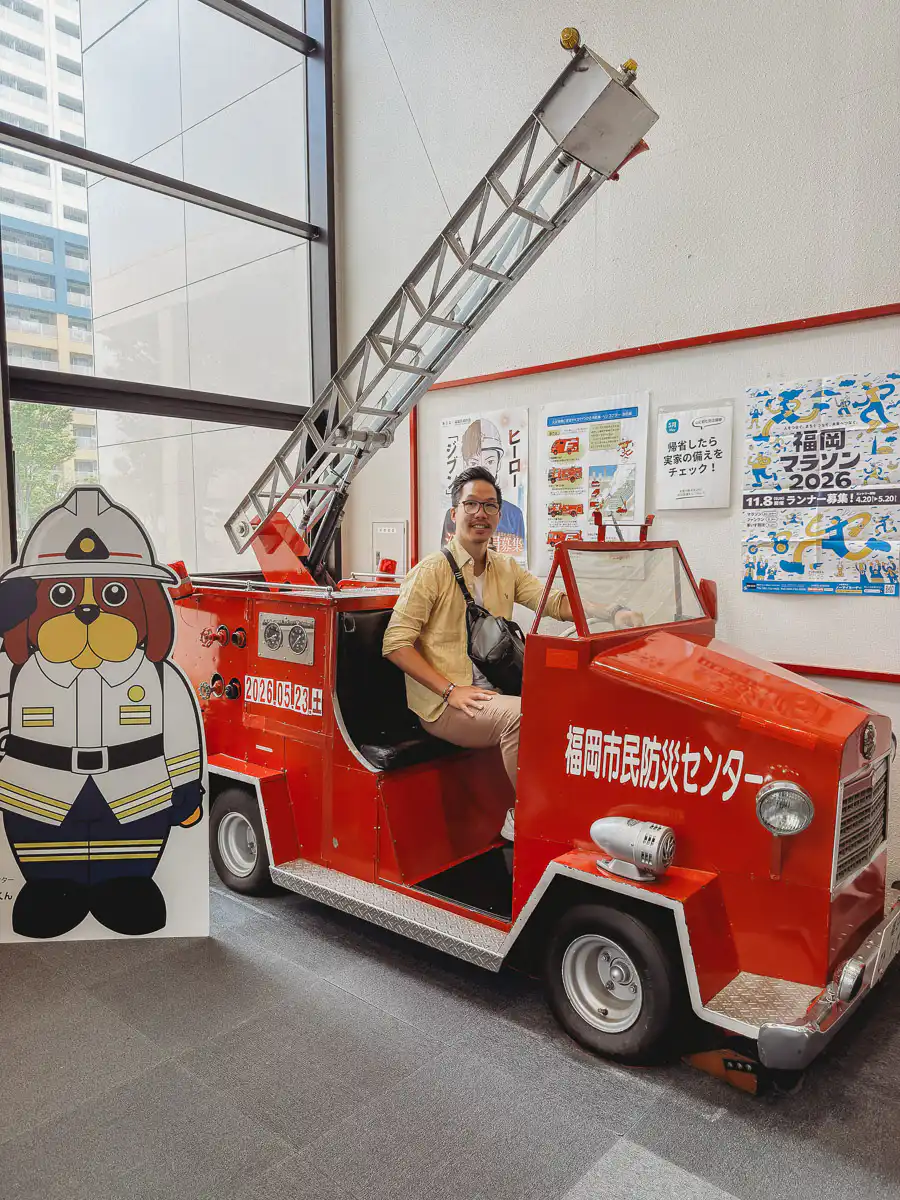 me sitting in firetruck at the fukuoka civic disaster emergency centre