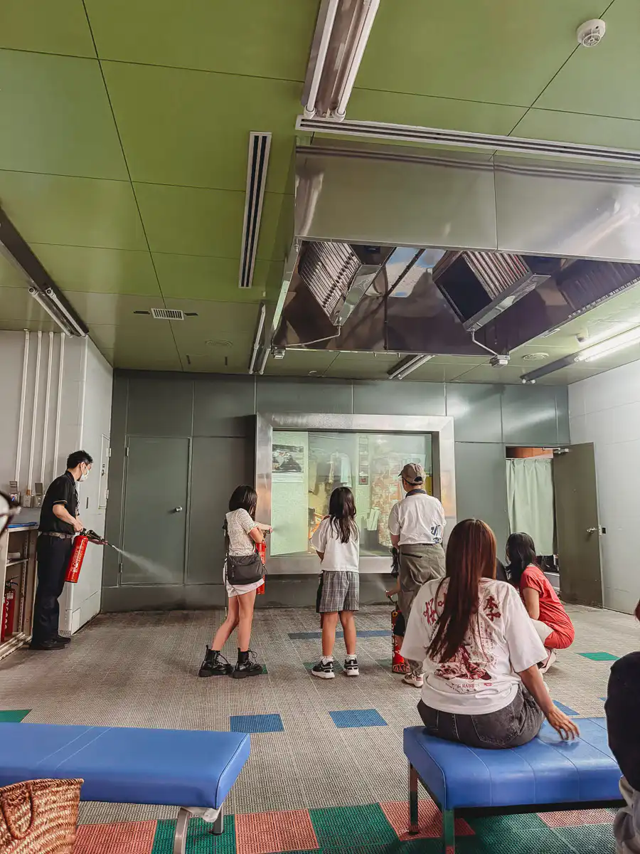 putting out a fire at fukuoka civic disaster emergency centre
