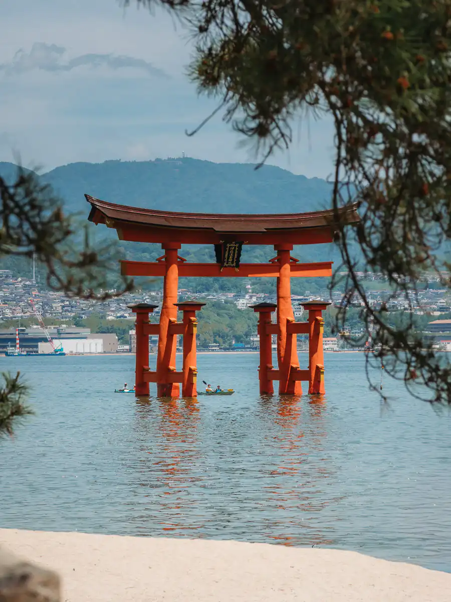 person kayaking to miyajima tori gate