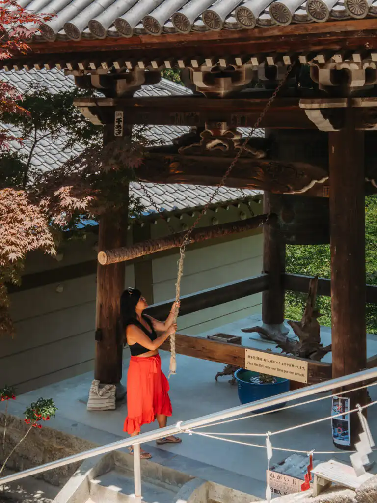 ringing the bell at daishoin temple on miyajima