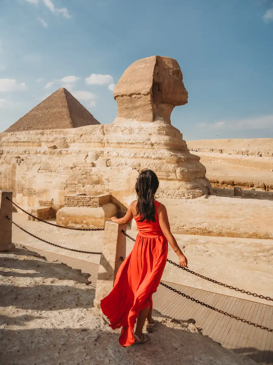 standing in front of the sphynx in Giza